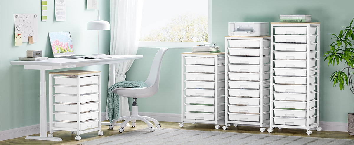 White rolling drawer carts beside a standing desk and chair in a mint green study room