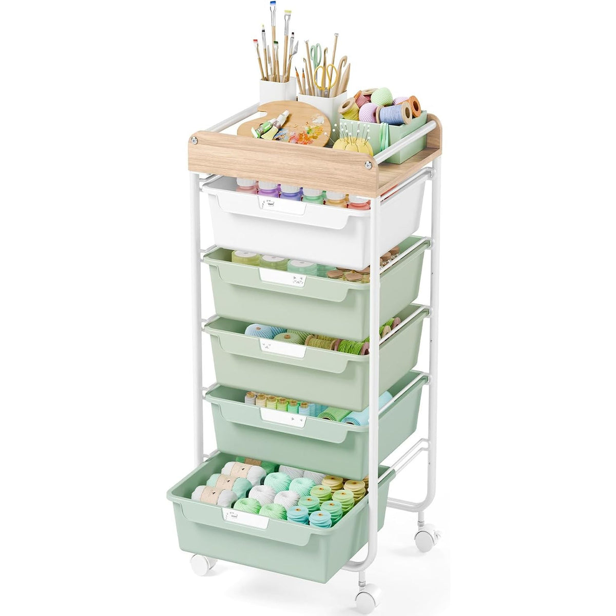 SYKIARIOL rolling storage cart with drawers, six-drawer version with sage green drawers holding paint pots