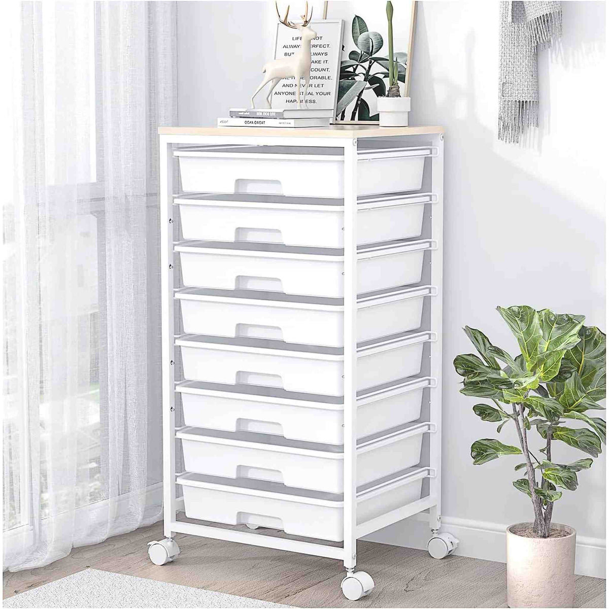 SYKIARIOL 8-drawer rolling storage cart, white drawers beside a plant