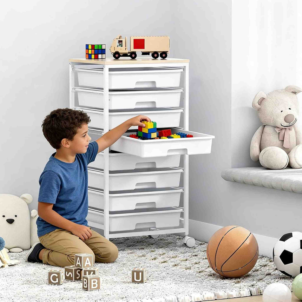 SYKIARIOL 8-drawer rolling storage cart – in a child's room with a boy playing with building blocks on an open drawer