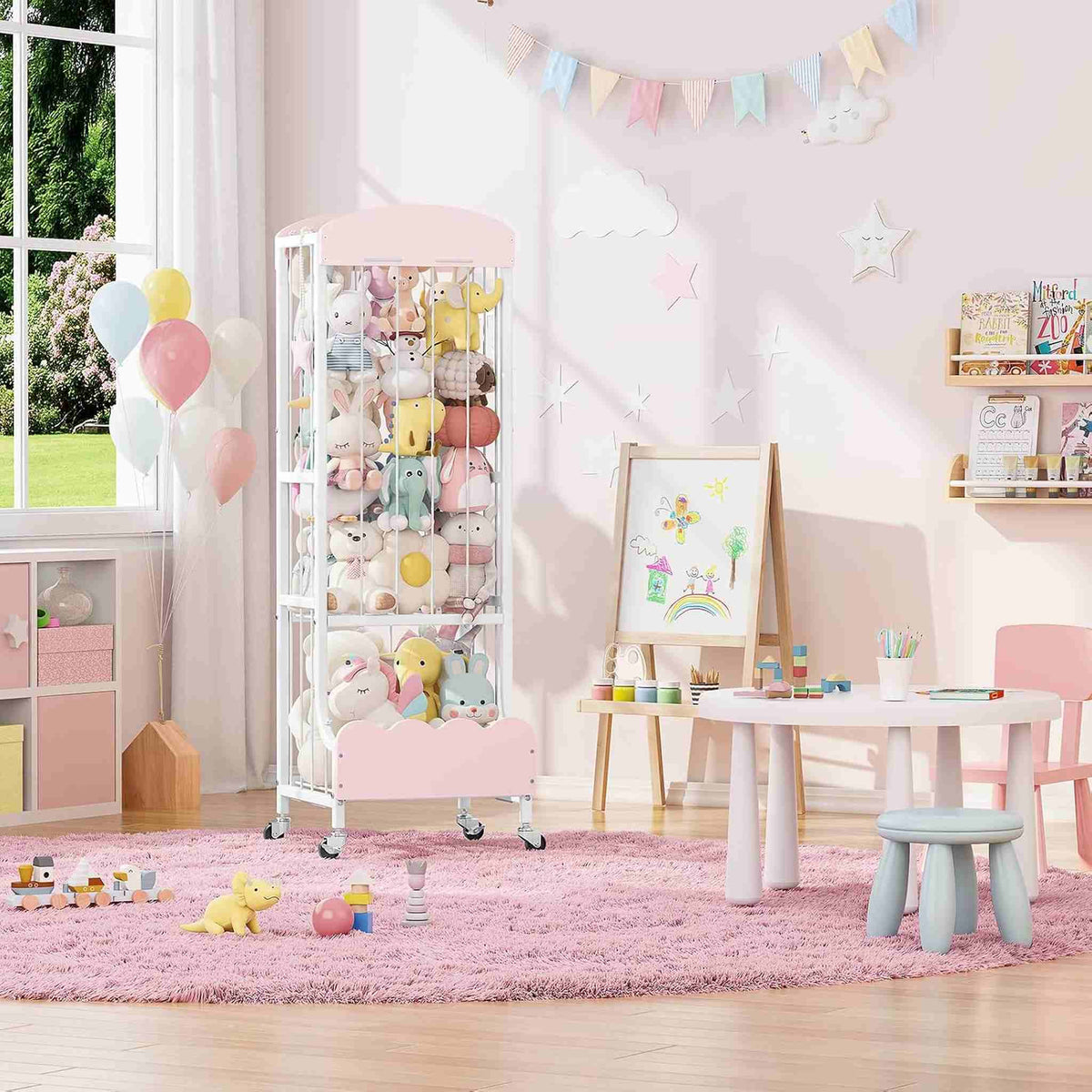 SYKIARIOL rolling stuffed animal storage – in a playroom next to a small table and chairs