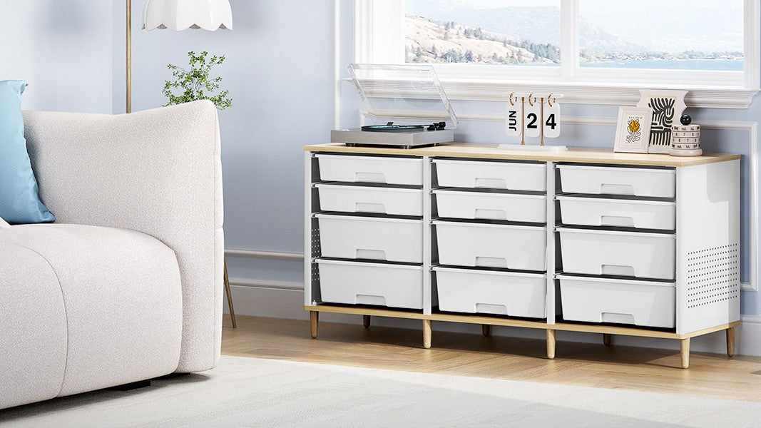White drawer storage cabinet beside a sofa in a living room with a window view