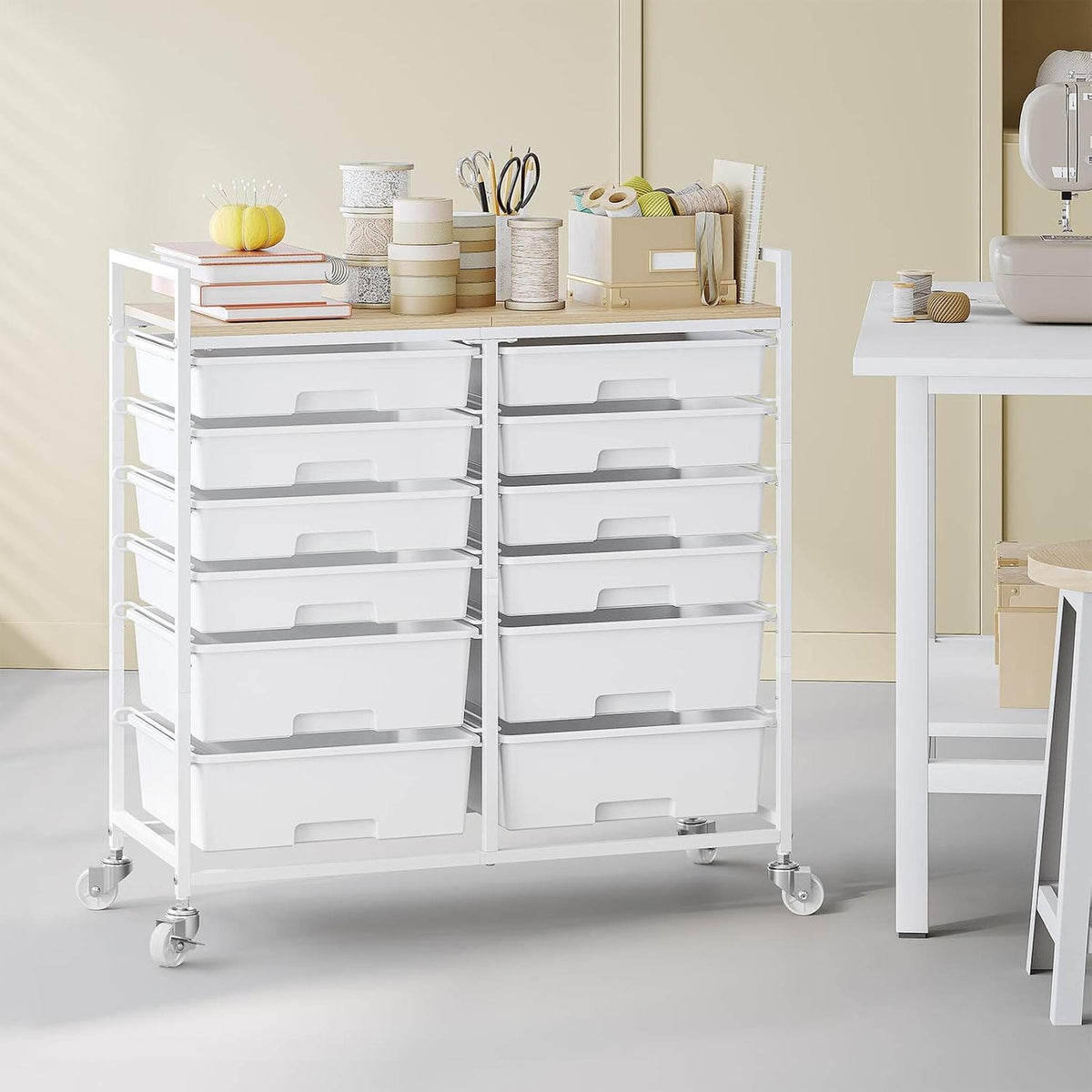 SYKIARIOL 12-drawer rolling storage cart, white version in a craft room