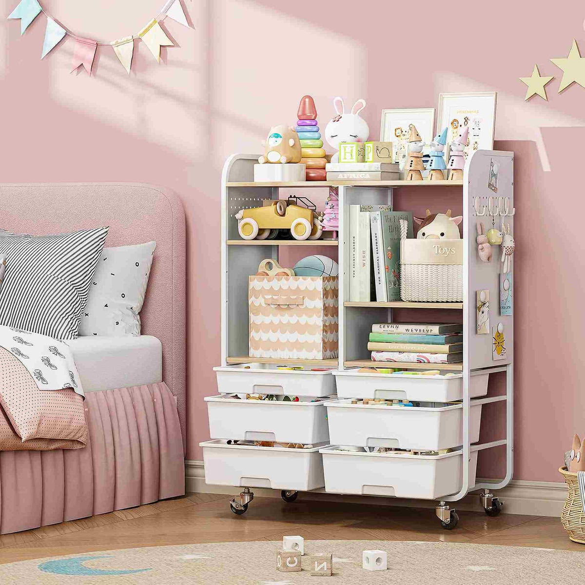 SYKIARIOL 6-drawer rolling storage cabinet – in a pink girl's bedroom holding toys and books